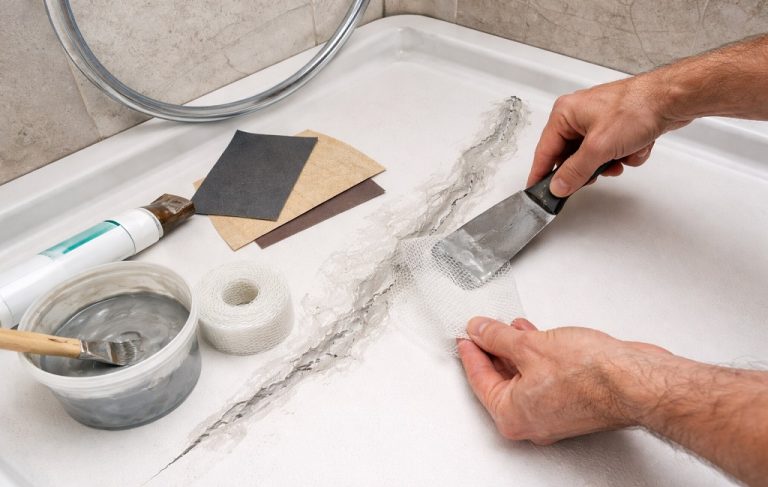 how to fix a cracked shower pan